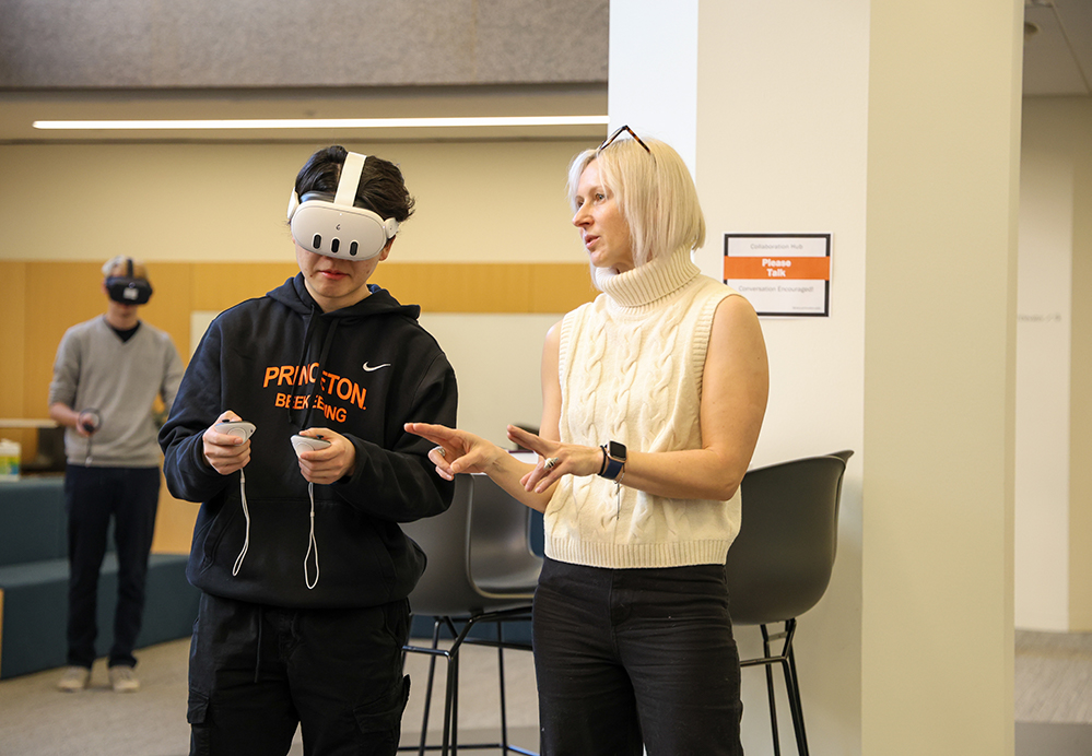 Marina Fedosik instructs a student during her class, Technogenesis in the Engineering Library's Collaboration Hub.