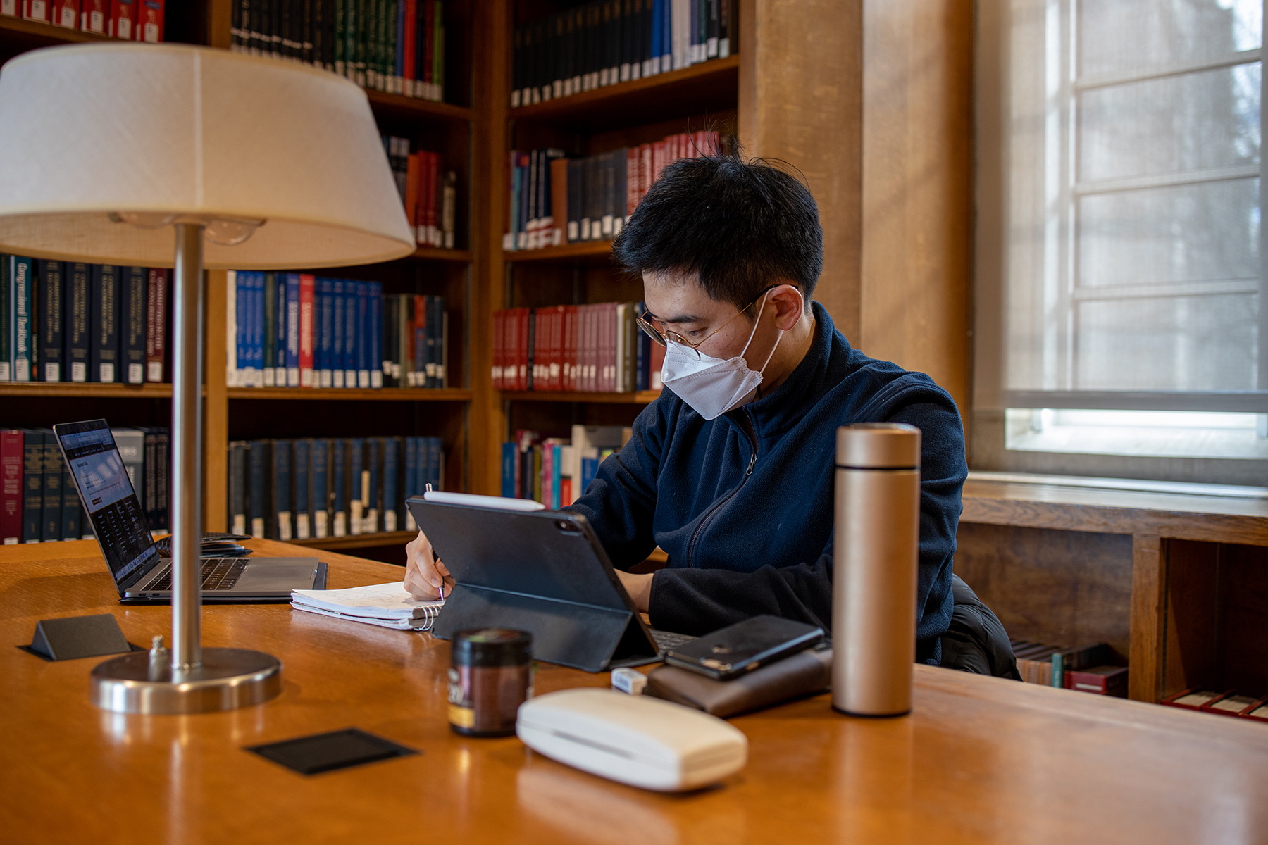 Student studying in Firestone Library