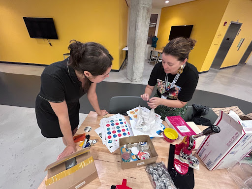 Ariel Ackerly and Julie Rae Tucker prepping for Munsee language button making at the Makerspace