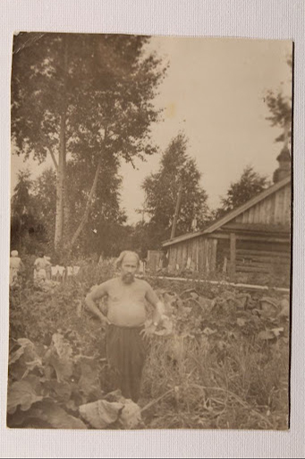 Sergei Alekseyev stands in a field in a photo from his correspondence to his American pen pal. Manuscripts Division, Department 