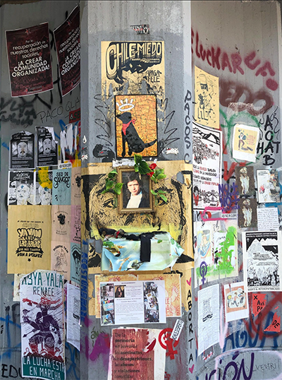 Posters on a concrete wall