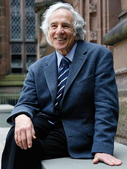 Profile picture of Emeritus Professor Stanley Corngold seated outside a Princeton University building.