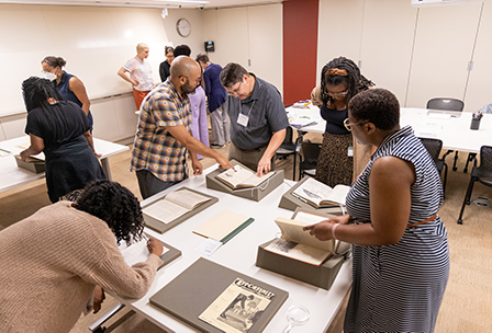 Kinohi Nishikawa and Jennifer Garcon helping Rare Book School attendees during their course on Black bibliography.