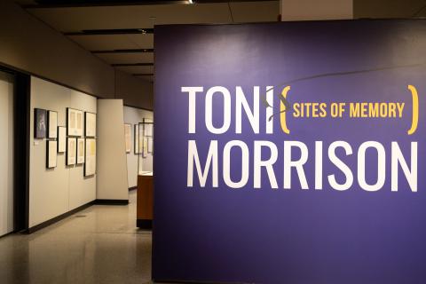 Large purple welcome panel in the Milberg Gallery for the Toni Morrison exhibition with a view into the gallery