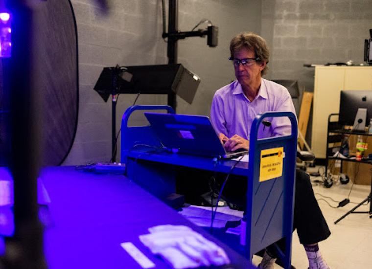 Mike Toth preparing an item for spectral imaging in PUL’s Digital Imaging Studio 