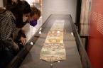 Visitors view one of the scrolls featured in “Through a Glass Darkly: The Ripley Scrolls 1400-1700.” 