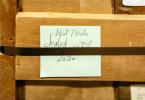 A crate that housed the Eliot letters for over 60 years with a post-it note reading "Eliot/Hale Sealed until 2020"