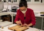 Project Conservator Victoria Wong repairs a PUL item. The Library’s Preservation and Conservation Lab is among the areas in whic